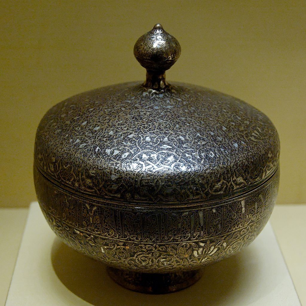 Art of the Seljuk Empire: Cup with lid. Hammered copper alloy with engraved decoration inlaid with silver and red copper, Iran, 1220–1230 or late 13th century–early 14th century_ Louvre Museum