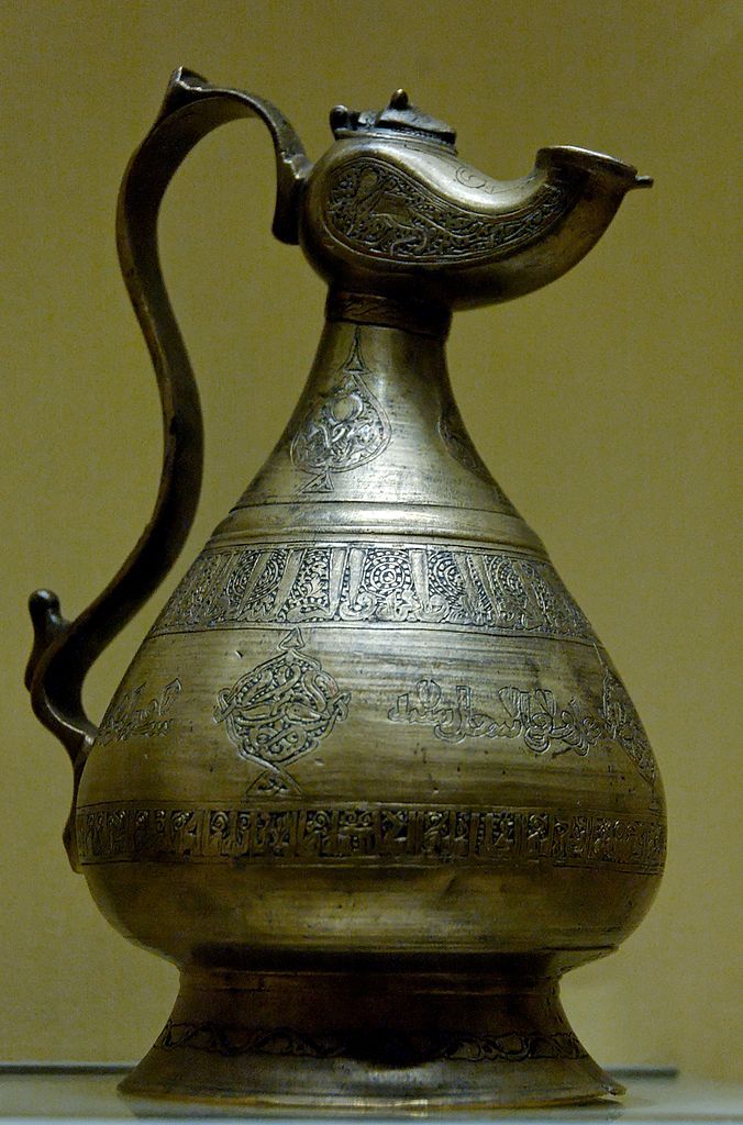 Art of the Seljuk Empire: Ewer inscribed in the name of ‘Othman ibn Sulayman and dated 586 AH. Copper alloy with engraved decoration inlaid with silver and red copper, Iran, 1190. Louvre Museum